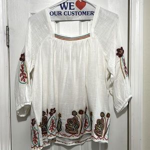 Ladies size 1X top with multi colored embroidery.